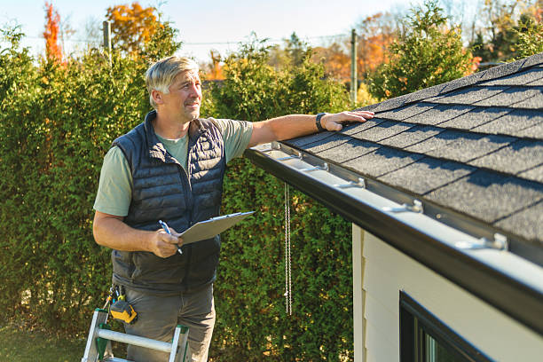 Professional Roofing technician working in Montour, IA